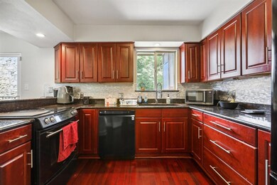 Kitchen with dishwasher, electric range, dark bro