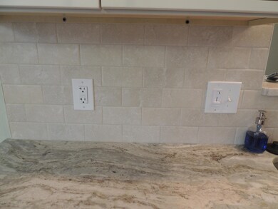 granite counters w/ tile backsplash