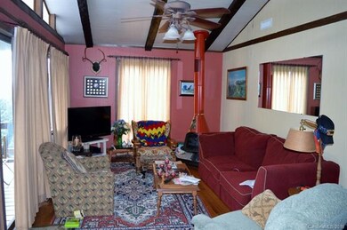 Living Room w/ beamed ceiling