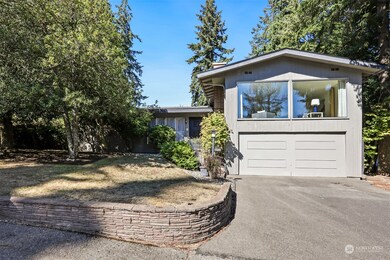 This mid century home has been well maintained over the years! Lots of parking with two car garage and big driveway.