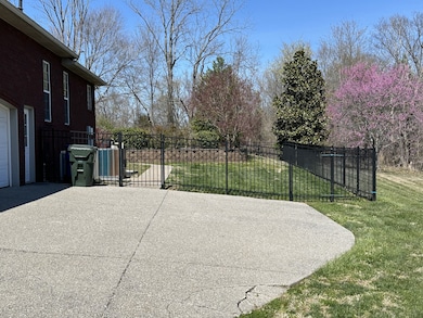 Metal privacy fence surrounding the pool, patio and entire back yard.