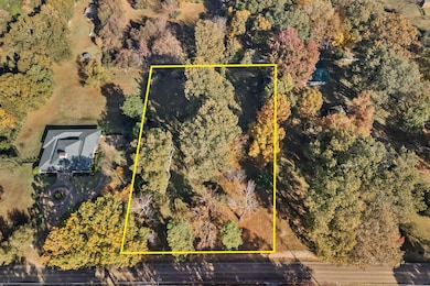 Aerial overview of property's location featuring property parcel outlined