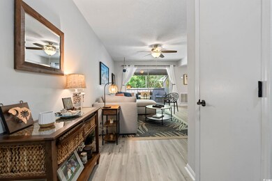 Hallway featuring wood finished floors and a textu