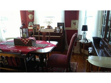 Formal dining room with hardwood floors, transom a