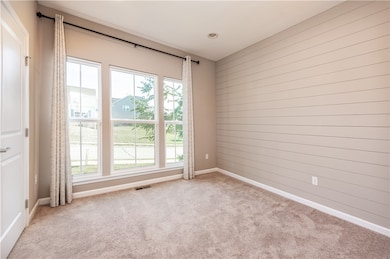 Front bedroom with with floor to ceiling windows which bring in an abundance of natural light.