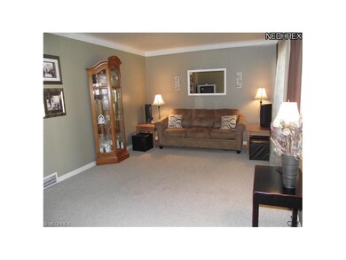 The roomy living room greets you as you enter.  Plenty of space for your big screen and furniture.