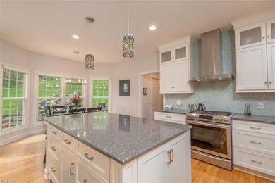 The remodeled kitchen with large island topped wit