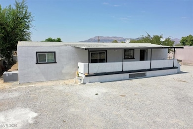 View of front facade with a mountain view and covered porch