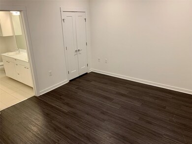 Unfurnished bedroom featuring wood finished floor
