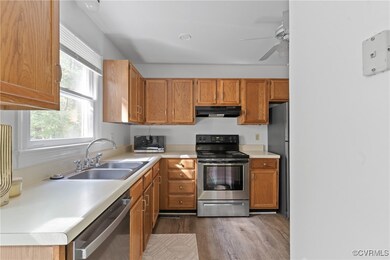 kitchen featuring ss appliances/lvp/large window