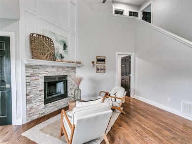 Living room featuring visible vents, baseboards, w