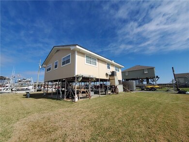 Rear view of house. Raised HVAC.