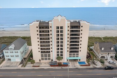 Birds eye view of property with a water view and a