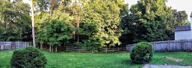 Mature wooded fenced back yard