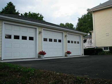 Parking Lot/Garage. oversized 3 car garage with do