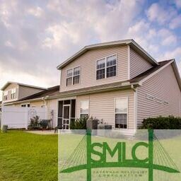View the side and rear exterior and patio with a l