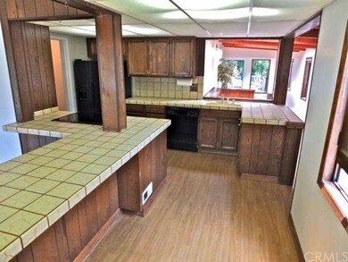 Kitchen with views of peninsula looking toward fam