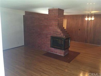 Living Room and Dining Room Separated By Fireplace