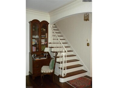 Beautiful Entry with Crown Molding and Hardwood