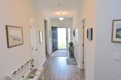 Corridor featuring hardwood / wood-style flooring