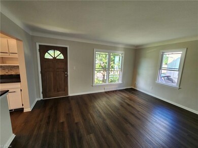 Entrance foyer with dark hardwood floors