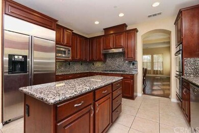 Gormet Kitchen With Cherry Wood Cabinets
