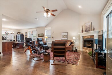 Living room with fireplace and high ceilings