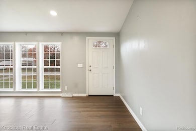 Foyer featuring recessed lighting and dark wood finished floors