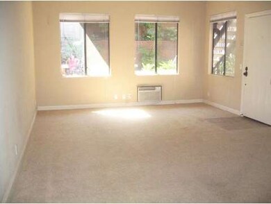 Bright living room looks out open space.
