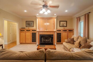 Family room has beautiful builtins and f