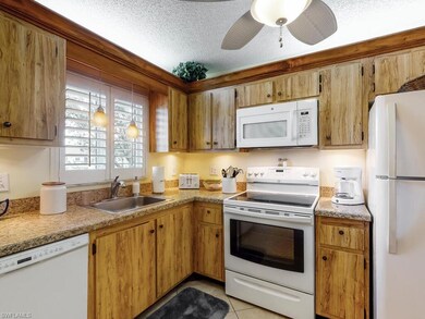 Sunny kitchen with white wood shutters