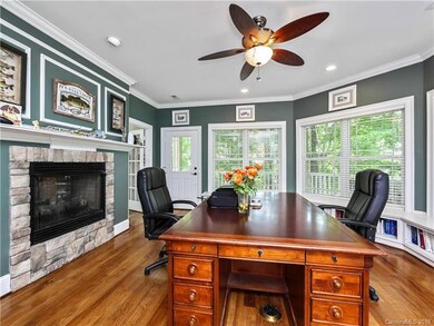 Office with see thru fireplace and window seats wi