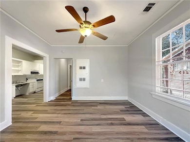 Unfurnished room with hardwood / wood-style floori