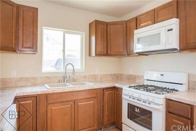 NEW CABINETS AND MARBLE TILE COUNTERTOPS