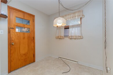 Eat-in area of kitchen and door to the garage.