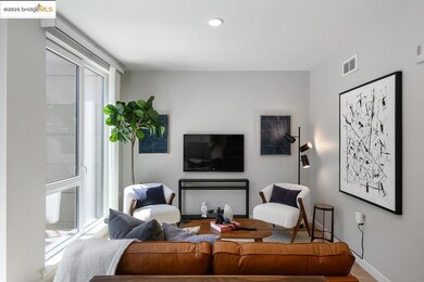 Living room with wood finished floors and recessed lighting