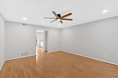Spare room featuring ceiling fan, baseboards, light wood finished floors, and recessed lighting