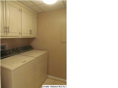 Another shot of the walk in laundry room with buil