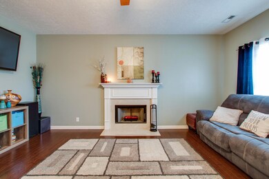 Cozy wood-burning fireplace in living room.