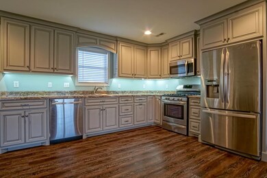 Exquisite kitchen! Luxury kitchen in an affordable priced house in a great location; close to the conveniences of stores, banks, pharmacies, auto stores and more!