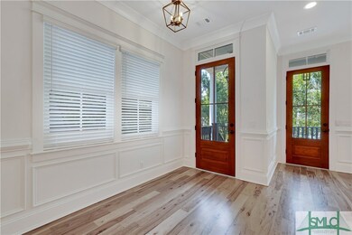 Entry door and door to upstairs covered porch off of living area