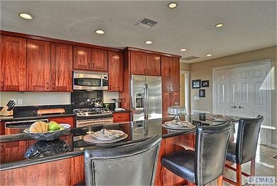 Cherry Wood cabinets with roll out shelves, stainl