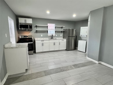 KITCHEN AND LIVING ROOM ARE OPEN CONCEPT.