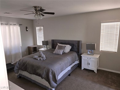 Bedroom featuring carpet floors, baseboards, and c