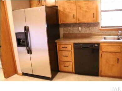 Side by side stainless refrigerator comes with the home ~ Large eat-in kitchen is a welcome treat for the close knit family.