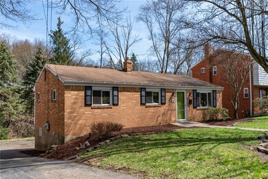 Gently sloped driveway, nicely manicured yard.