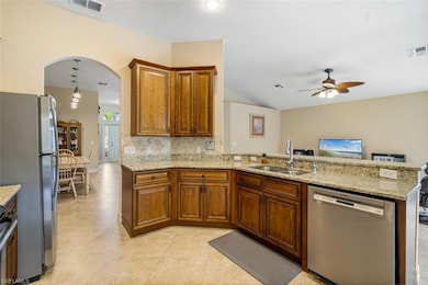 Kitchen featuring stainless steel appliances, visi