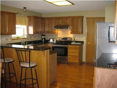 Wrap kitchen with Grantite counters and hardwood f