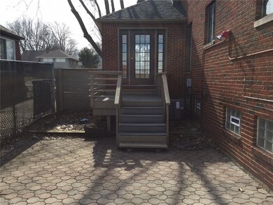 Back deck with floor made of composite decking.