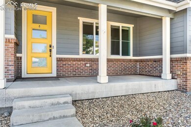 View of exterior entry with a porch